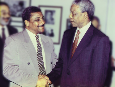 Jackie Robinson  meeting with former President Nelson Mandela of South Africa to prepare for Apple Computer's return to the South African Market. 